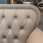 Cream Diamond-Tufted Leather Sofa with Scroll Armrests and Dark High-Gloss Wood Sides